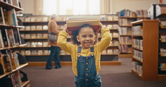 child smiling in a library